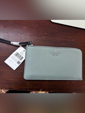 Kate Spade Lucy peopled leather medium L zip wristlet sold out adventurine color